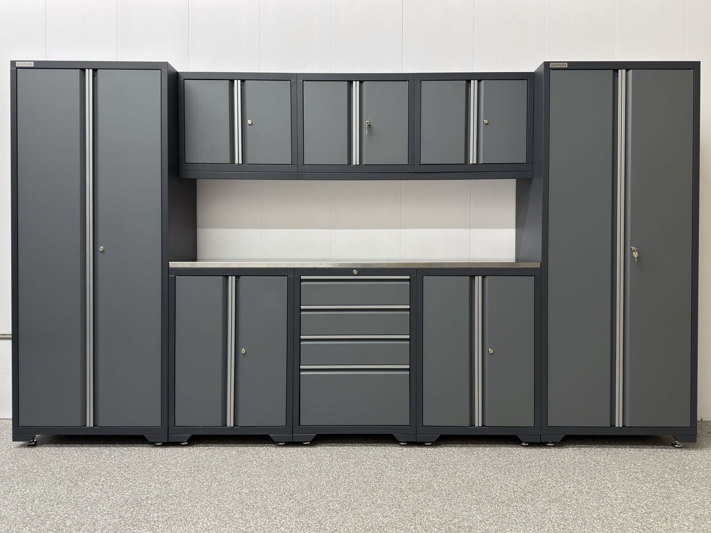 Uromoda _uno 9-Piece set: two tall cabinets, three wall cabinets over a 72-inch stainless steel work surface, a drawer base between two door bases